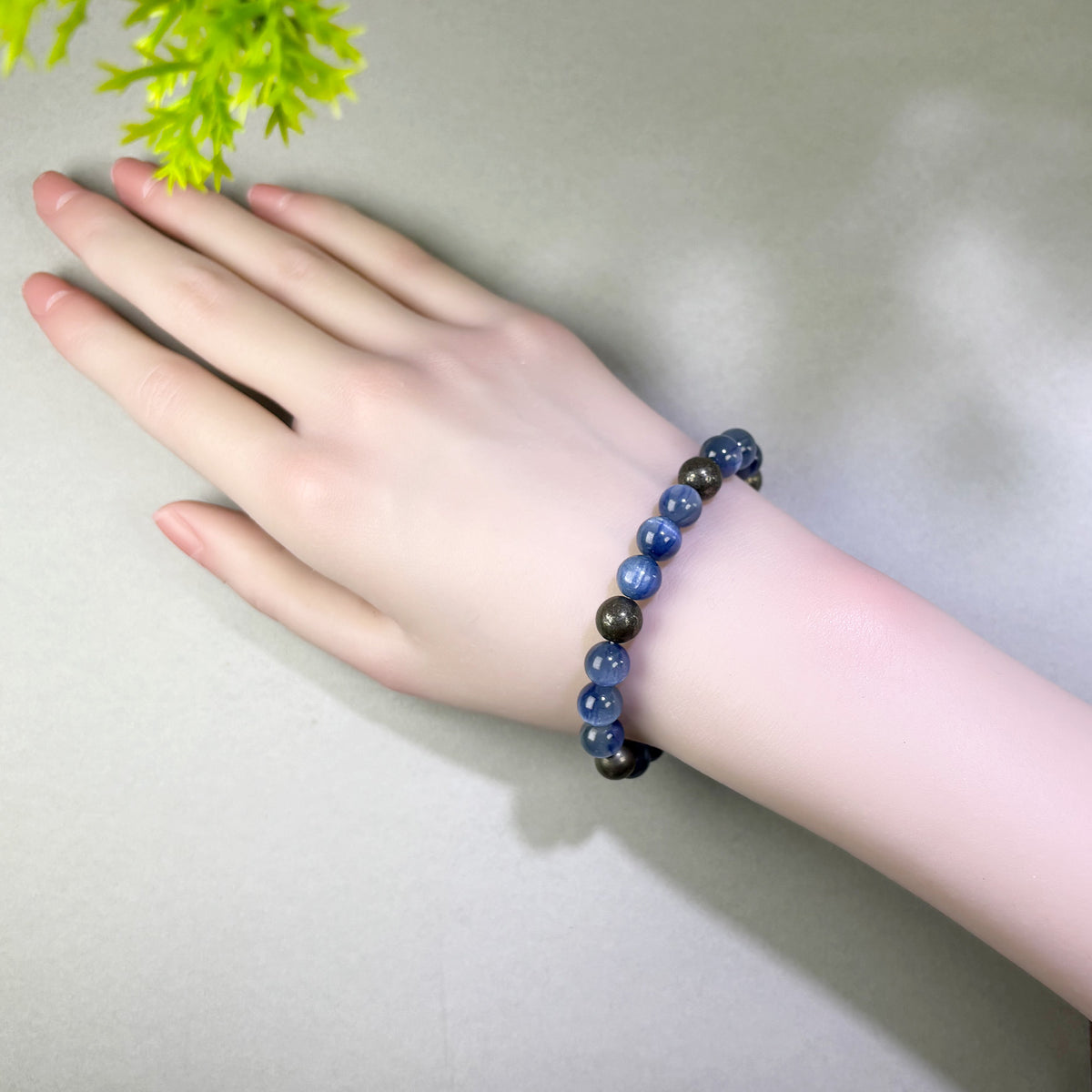 Blue Kyanite and Pyrite bracelet worn on wrist for making clear requests in salary, promotion, and career conversations