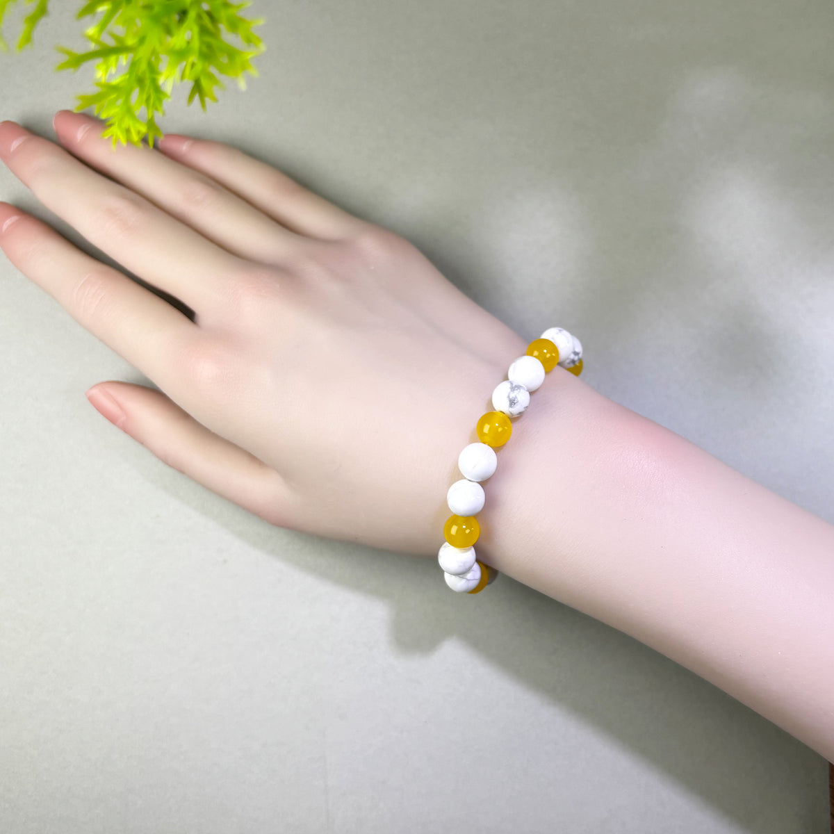 Howlite and Yellow Agate bracelet worn on wrist for staying patient when progress takes longer than expected