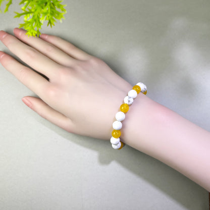 Howlite and Yellow Agate bracelet worn on wrist for staying patient when progress takes longer than expected