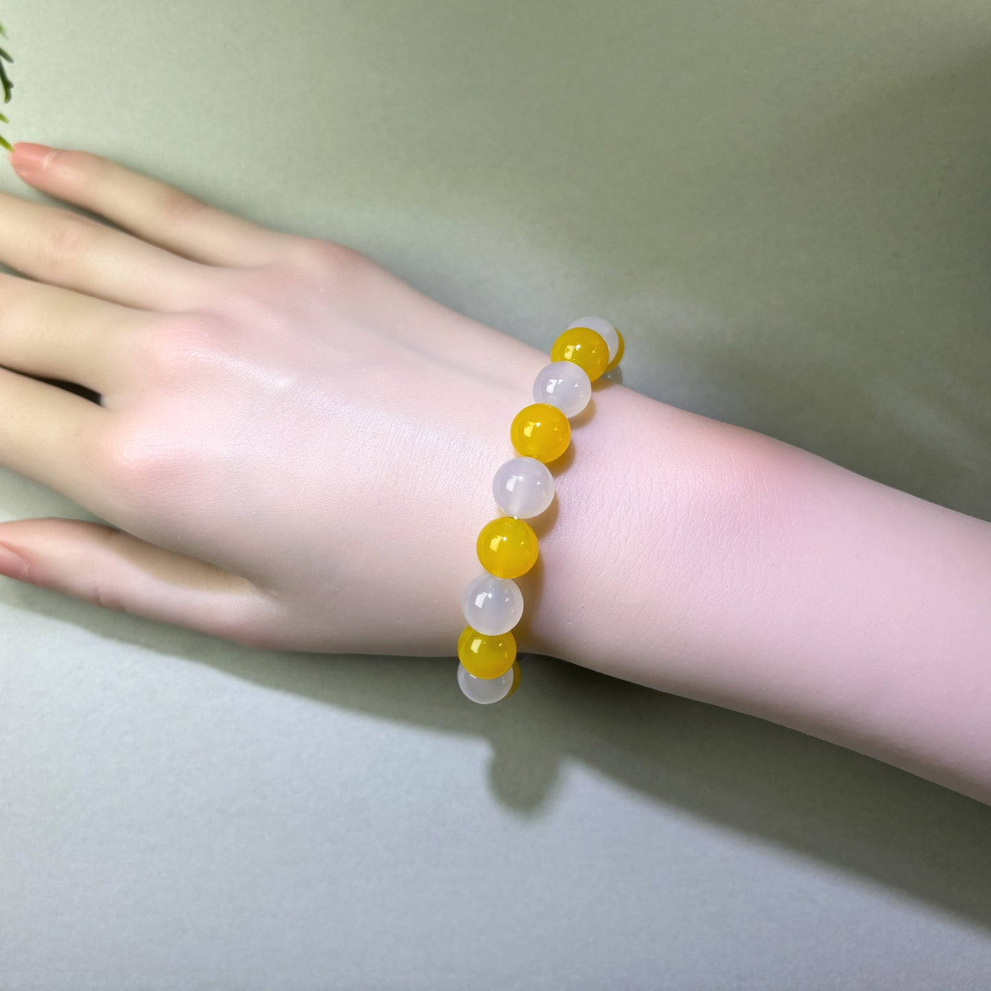 Yellow Agate and White Agate bracelet worn on wrist for helping thoughts settle naturally at night